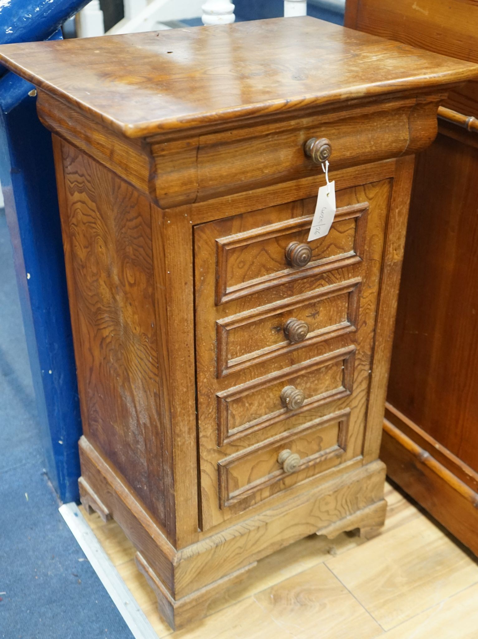 A 19th century French elm bedside cabinet with dummy drawer front, width 47cm, depth 36cm, height 76cm